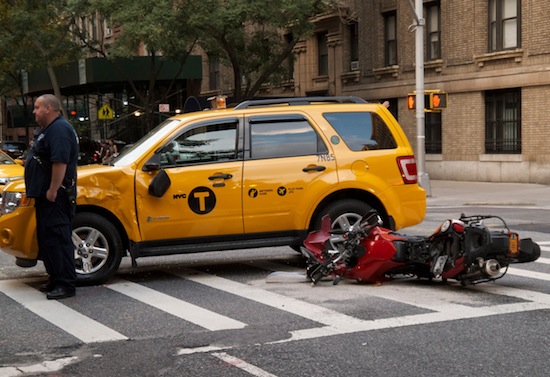 TAXI-MOTORCYCLE COLLISION ON 83RD