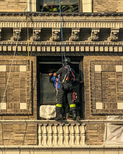 Two Workers Saved from Dangling Scaffolding in Dramatic Rescue