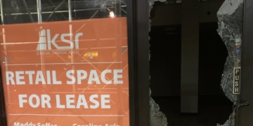 Glass Shattered by Bricks on Broadway