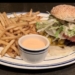 Here’s the Dish: Mel’s Burger Bar’s Prime Burger (Pictured With a Side Order of Crispy Fries)