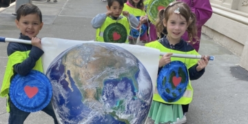 Preschoolers ‘Clean Up Their Sandbox’ and Hold a Parade In Honor of Earth Day
