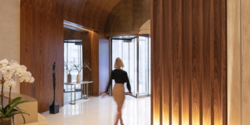 Inside A Uniquely Curved Residence at the Iconic Glass Building, 212 West 72nd Street   