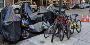 NYPD Seizes Mopeds, Bikes Illegally Chained Near Stratford Arms Hotel; Woman Arrested