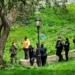 Homeless Individual Rousted from Riverside Park by Contingent of Officials on Saturday Morning